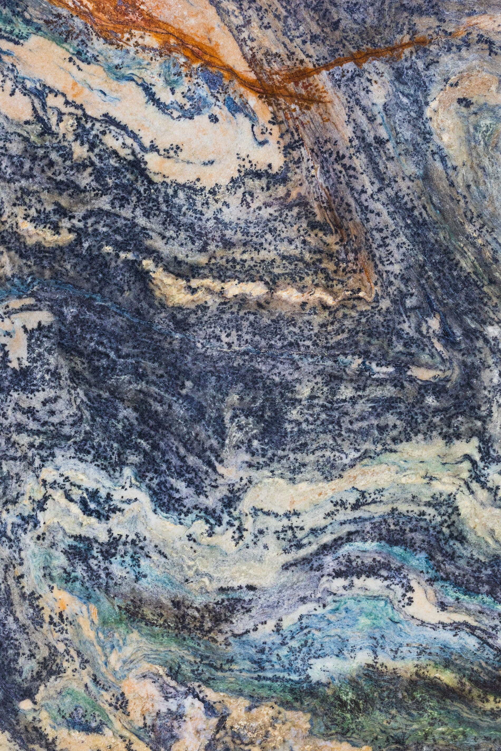 Exotic stone slab swirling with blue, gold and copper tones