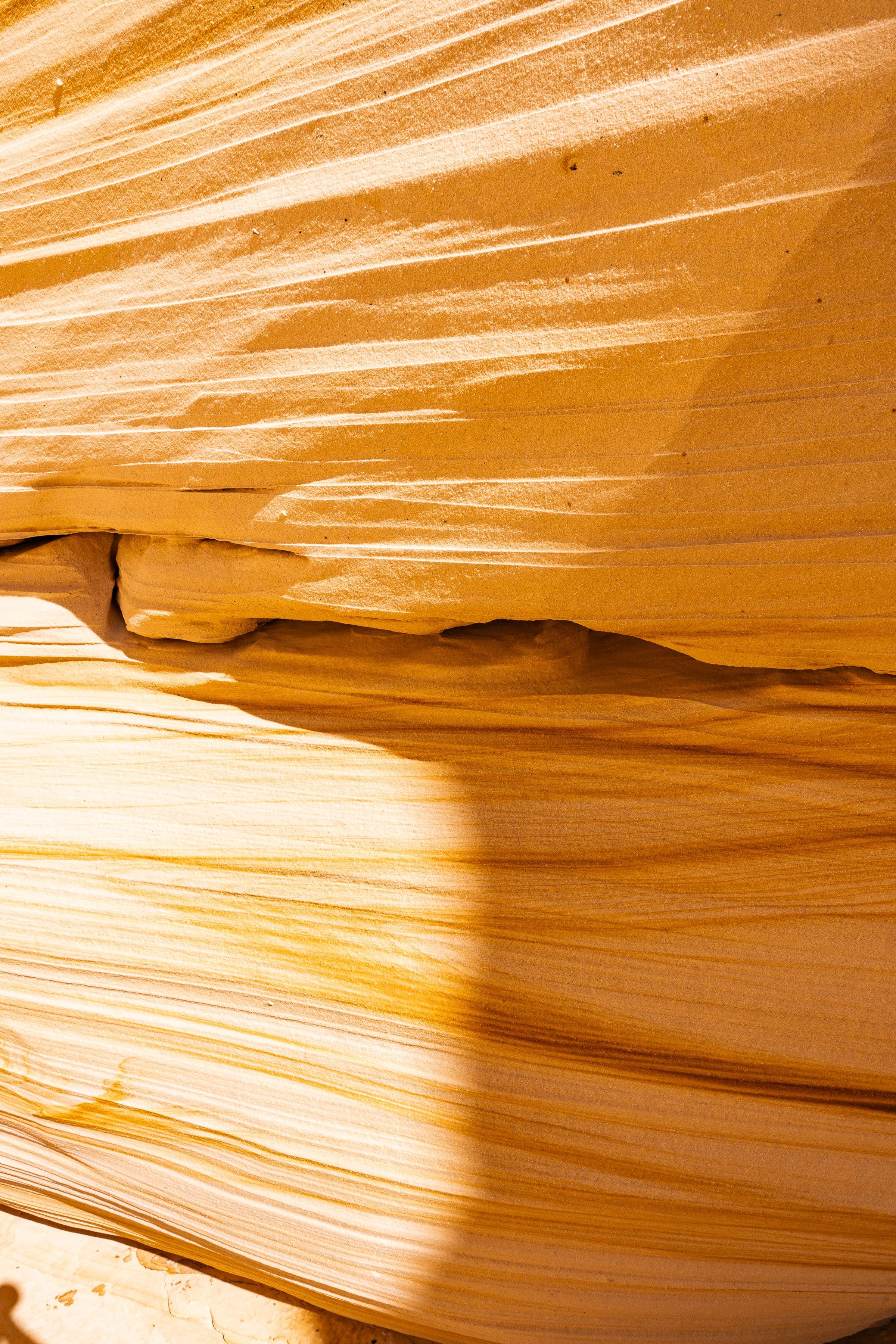 Warm golden sandstone with natural sedimentary striations