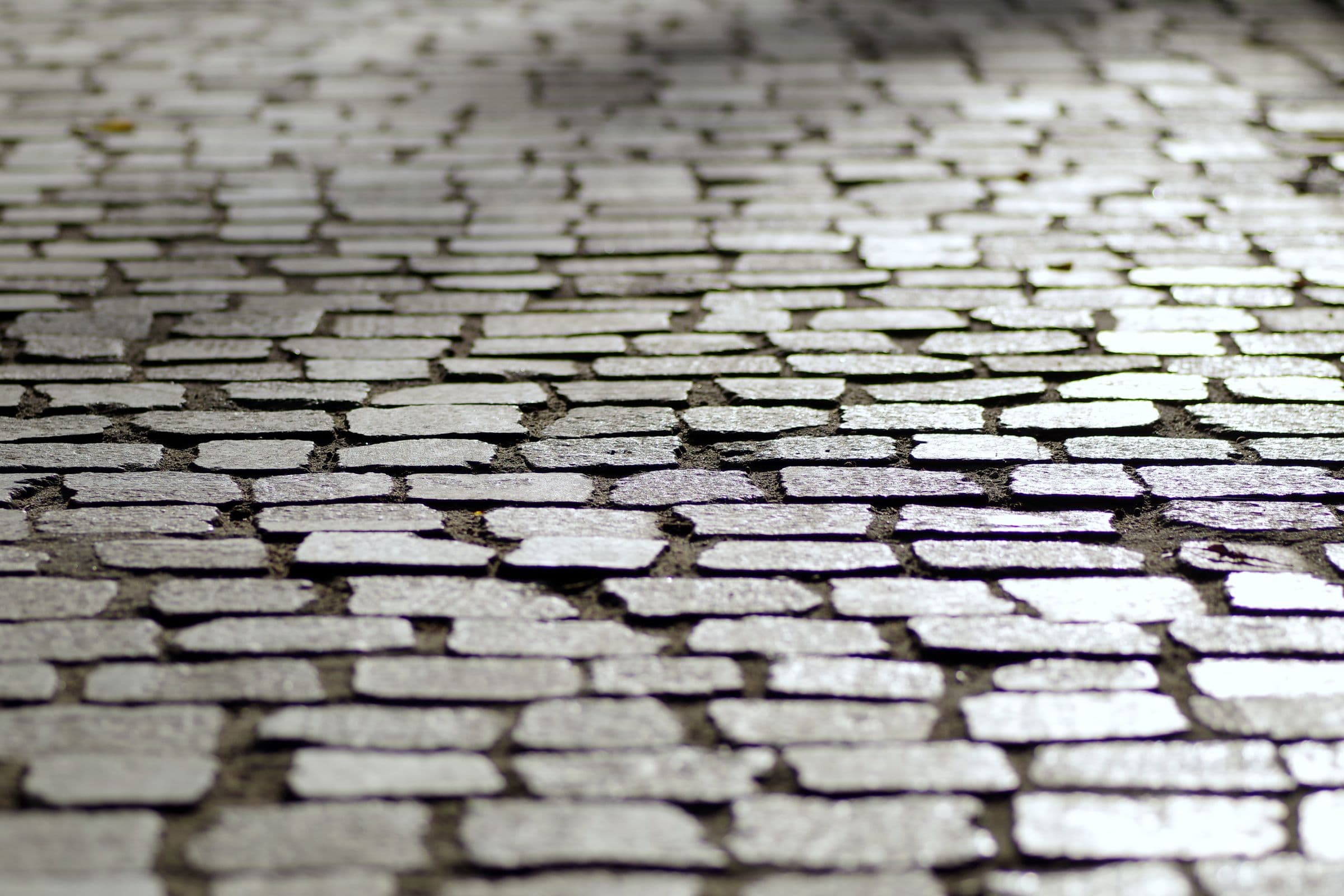 Natural stone cobbles laid in a paved street